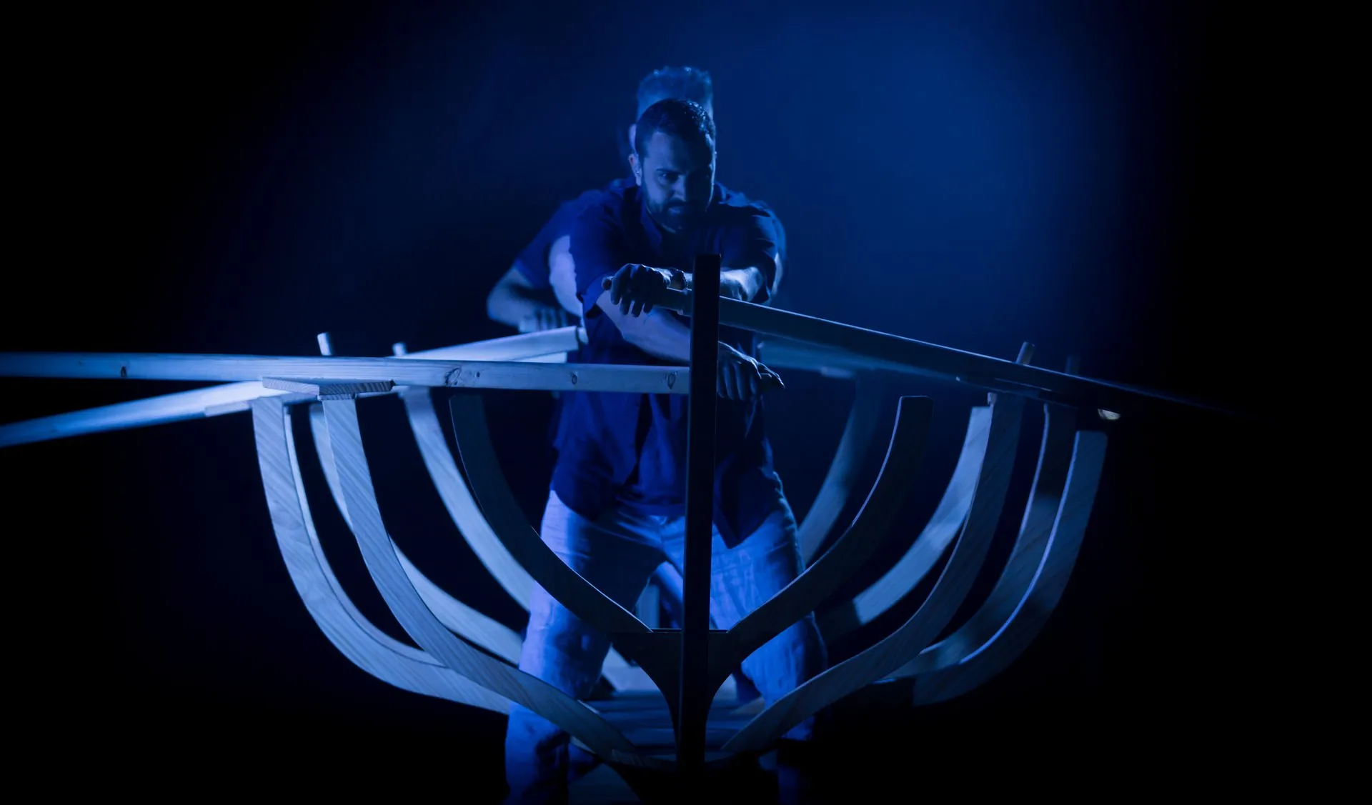 Skeleton of a boat under blue light